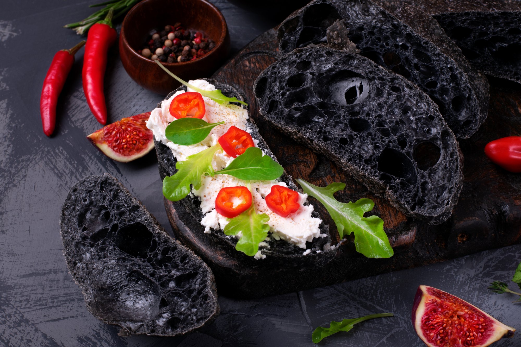 black ciabatta bread with pepper, lettuce and cream cheese